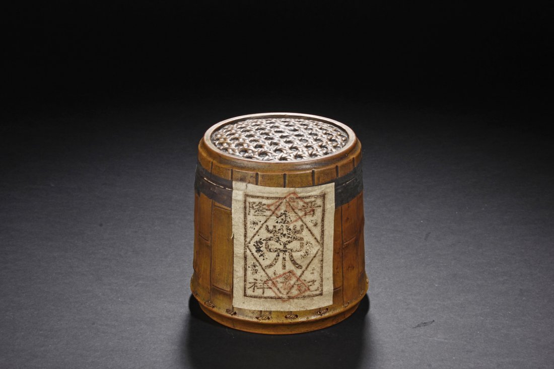 YIXING DUAN CLAY TEA JAR WITH PU ER TEA: Of cylindrical form, the jar shaped similar to a bamboo barrel with detailed bamboo sections and string sections, the character "Cha" incised on one side, the seal "Jing Long Xiang Ji" on the reverse,