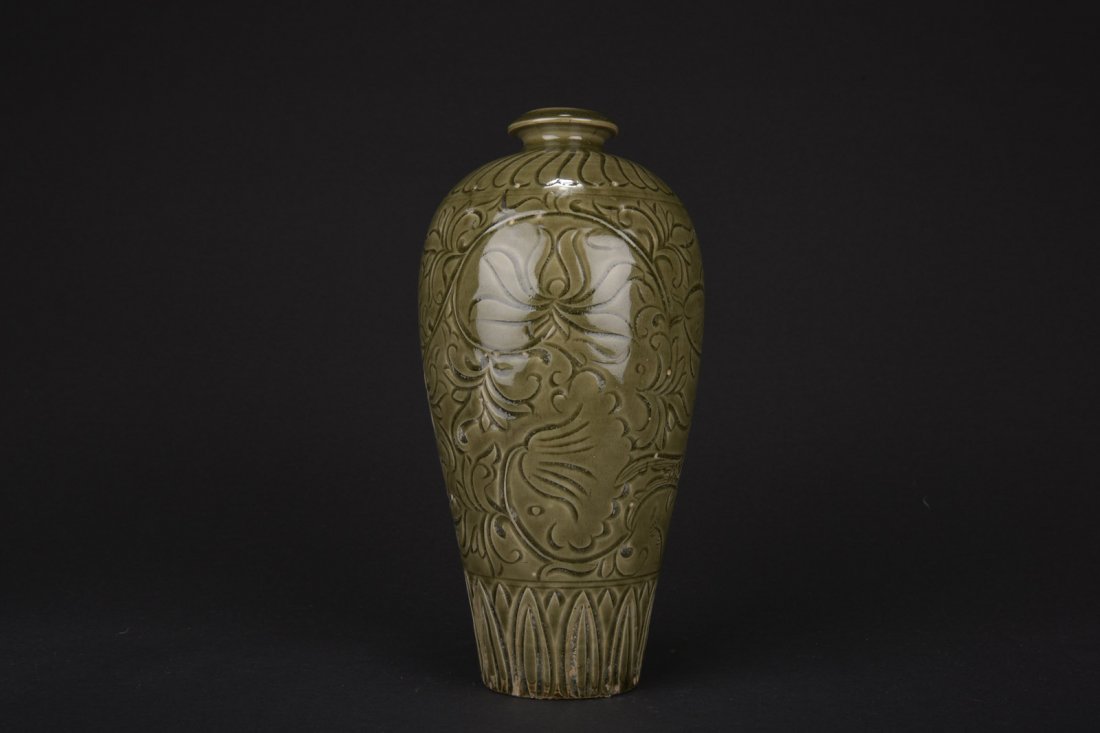 LONGQUAN WARE GREEN GLAZED 'FISH AND FLOWER' VASE: Of tapering form with wide shoulders, the vase's body depicts fishes swimming around lotus flowers between leaf patterns, glazed overall in olive green. 20th C. H: 12 in (30.5 cm) D: 5 1/4 in (13.3 cm