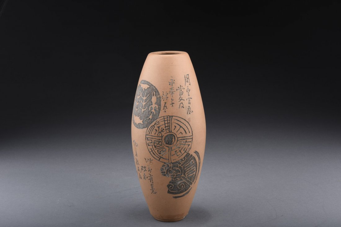 WU DESHENG: YIXING PURPLE CLAY BOTTLE VASE: Of olive form, the Yixing purple clay bottle vase incised with symbols, colophons, and signatures, bottom bears four character 'Wu Desheng' mark. H: 9 in (22.8 cm) D: 4 1/8 in (10.4 cm)