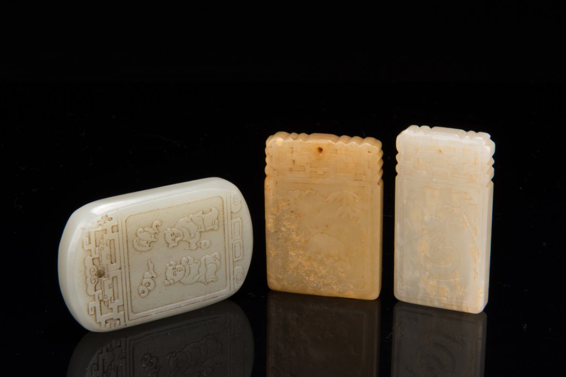 THREE CARVED JADE PENDANTS (1 of 10)