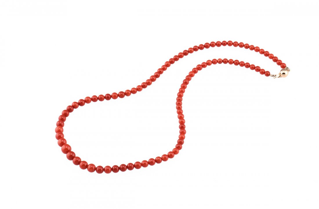 RED CORAL BEAD NECKLACE: The necklace consists of 97 natural coral beads approximately 4.1 mm. Length: 17 in (43.2 cm) Diameter: 4.1 mm