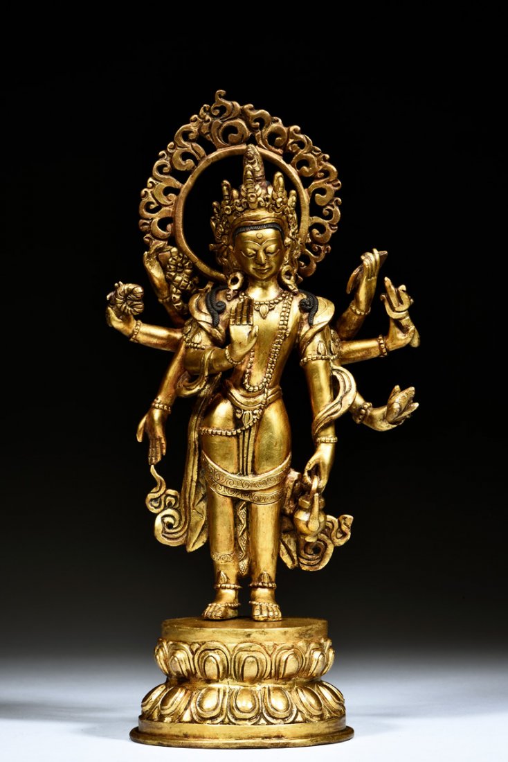 GILT BRONZE STANDING EIGHT-ARM AVALOKITESVARA (1 of 7)
