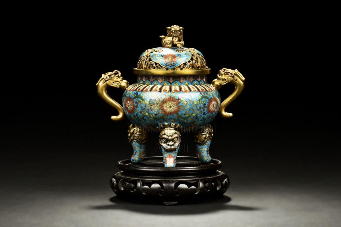 CLOISONNE ENAMELED 'MYTHICAL BEASTS' TRIPOD CENSER: The cloisonne enameled censer stands on three beast hoof legs extending from beast masks, supporting a globular body with floral patterns, two dragon form handles attached to the side, complete with d