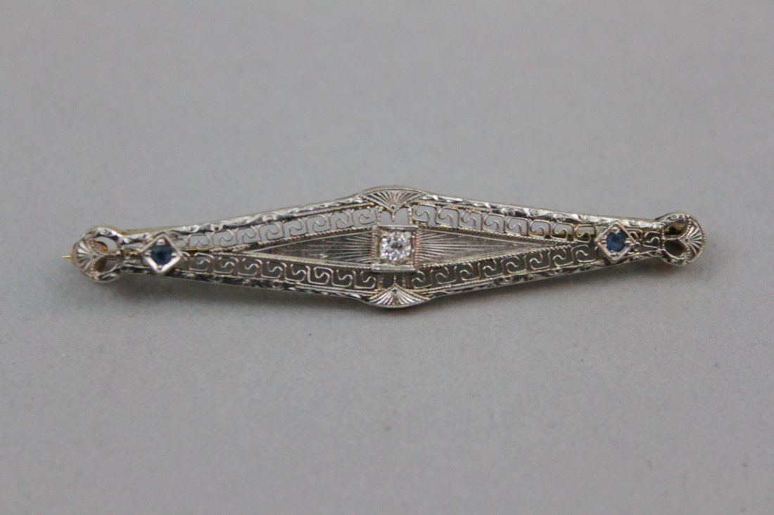 J.E. Caldwell Art Deco 14 Karat YG/WG & Diamond Pin: J.E. Caldwell Art Deco 14 Karat YG/WG & Diamond Pin. White gold topped yellow gold. Unmarked, tested, retaining its original Caldwell gilt decorated leather case. 2 1/4" long. 3.0 dwt.