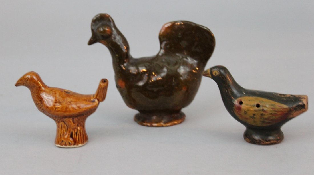 Lot of Three Antique Earthenware Bird Whistles/Figures: Lot of Three Antique Earthenware Bird Whistles, comprising a Bennington glazed porcelain example, a European cold painted redware example, and an unsigned Jugtown pottery shaker, 3 3/4" tall, largest.