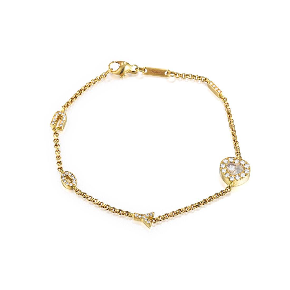 Chopard Happy Diamonds "I Love You" Bracelet: Crafted out of 18K yellow gold, accented by 44 round brilliant-cut diamonds, weighing a total of approximately 0.50 carats, with G-H color and VS clarity; length 7-3/4 inches; weight 9.1 g. Signed Cho