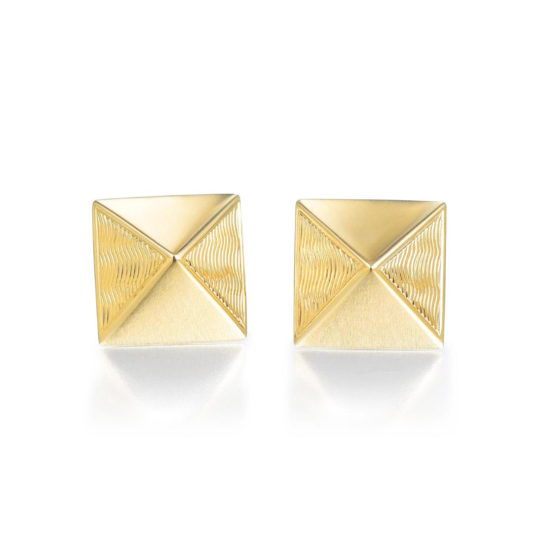 Van Cleef & Arpels Gold Pyramid Earrings: Designed as a pair of pyramid-shaped earrings, crafted out of 18K yellow gold, each earring with two polished smooth sides and two textured sides; each earring measures 9/16 x 9/16 inches; weight 4.1