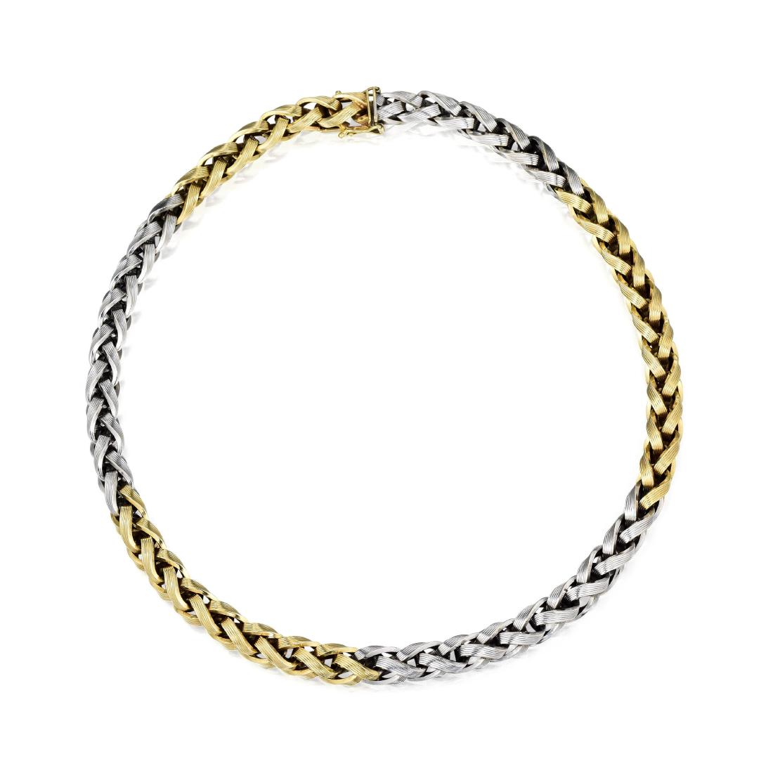 Van Cleef & Arpels Necklace: A textured wheat chain in alternating 14K white and yellow gold; finished with a box clasp and safety; length 14-5/8 inches, width 1/4 inch; weight 36.98 g. Signed: VCA; Stamped: 14kt Germany; Numbere
