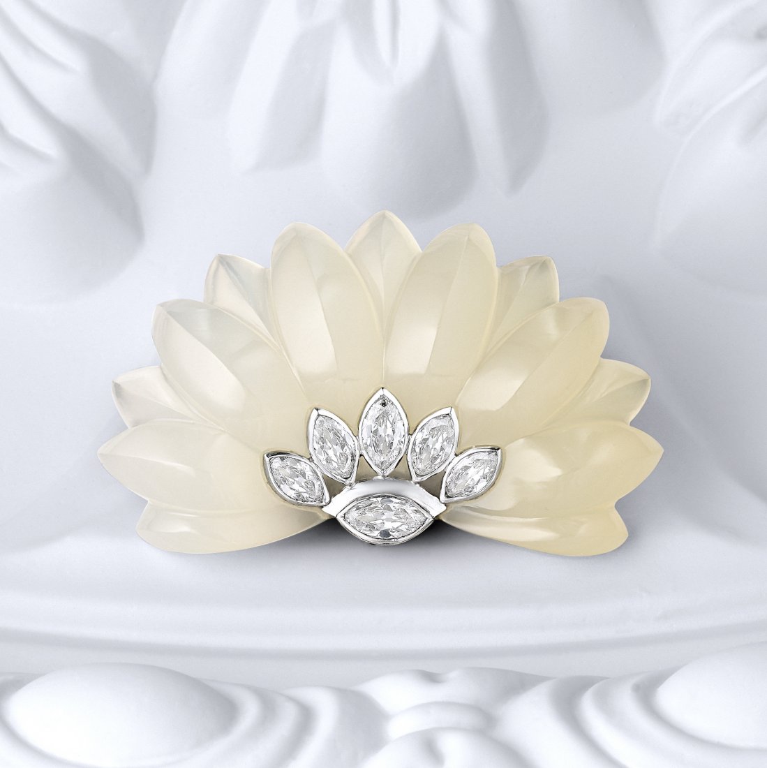Suzanne Belperron Chalcedony Diamond Clip: A carved chalcedony fan clip accented by marquise diamonds weighing a total of approximately 1.65 carats set in platinum; with I-J-K color and SI-I clarity; fastened with an 18K white gold clip; measu