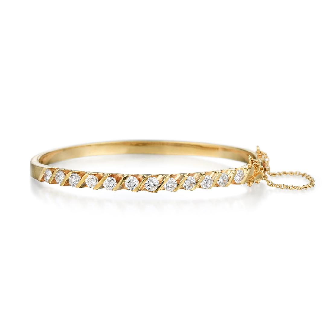 An 18K Gold Diamond Bangle (1 of 2)