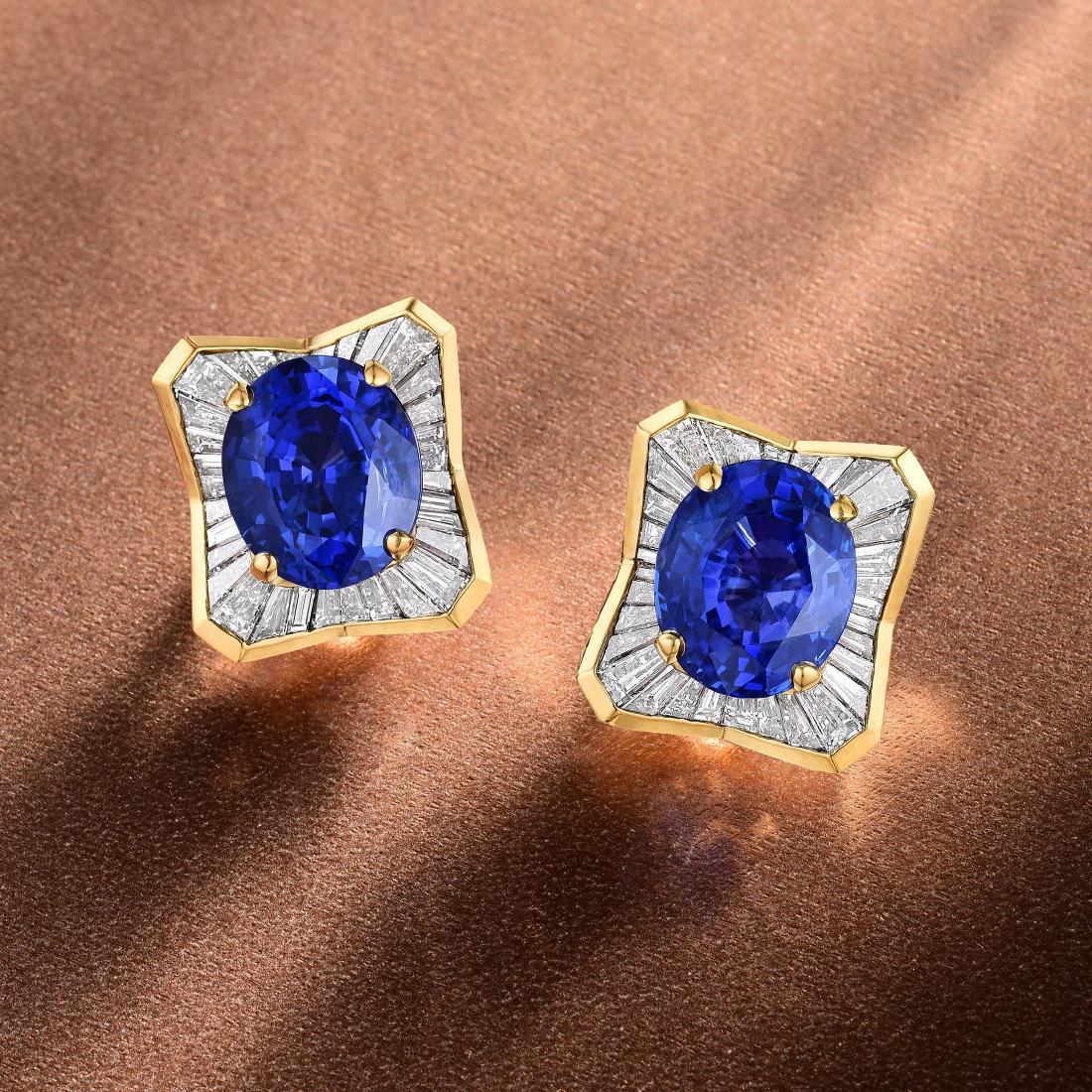 Julius Cohen Unheated Ceylon Sapphire And Diamond: Crafted in 18K gold; featuring two oval-shaped lively unheated Ceylon sapphires weighing 10.12 carats and 9.94 carats; surrounded by 64 tapered baguette-cut diamonds weighing a total of approximately