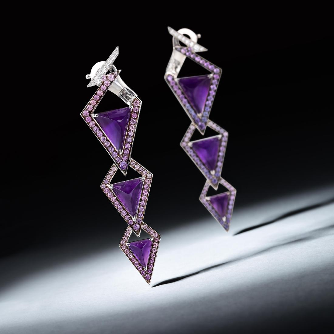 Stephen Webster Lady Stardust Drop Earrings: METAL: 18K white gold GEMSTONE(S): synthetic amethysts; purple sapphires weight 1.94 carats; round brilliant-cut diamonds weight 0.13 carat, F-G/VS (gemstone and diamond weight known) MEASUREMENTS: 2-