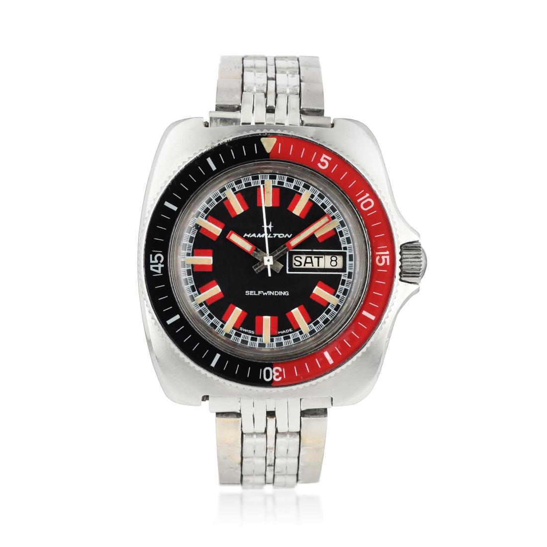 Hamilton Racing Dial Diver in Steel: CIRCA: 1970s REF.: 826016-3 CASE MATERIAL: Stainless steel CASE DIMENSIONS: 40 mm in diameter DIAL: Matte black with large luminous hour markers flanked by red accents, inner racing track BRACELET MAT