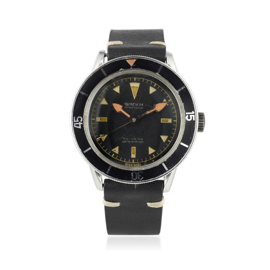 Gruen Ocean Chief in Steel: CIRCA: 1950s REF.: 560 RSS 165 CASE MATERIAL: Stainless steel CASE DIMENSIONS: 39 mm wide x 42 mm lug-to-lug DIAL: Matte black with gilt-framed triangular luminous-filled hour markers BRACELET MATERIA