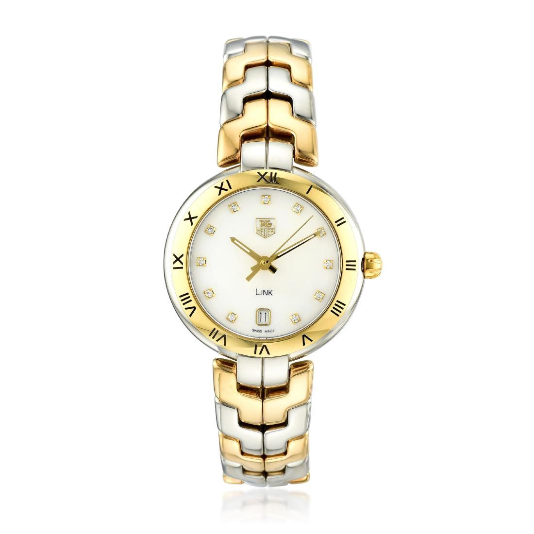 TAG Heuer Ladies Link Ref. WAT1353.BB0962 in 18K Gold: CIRCA: 2017 REF.: WAT1353 CASE MATERIAL: 18K yellow gold and stainless steel CASE DIMENSIONS: 34.50 mm in diameter DIAL: Mother of pearl with diamond hour markers, date aperture at the "6" hour marker