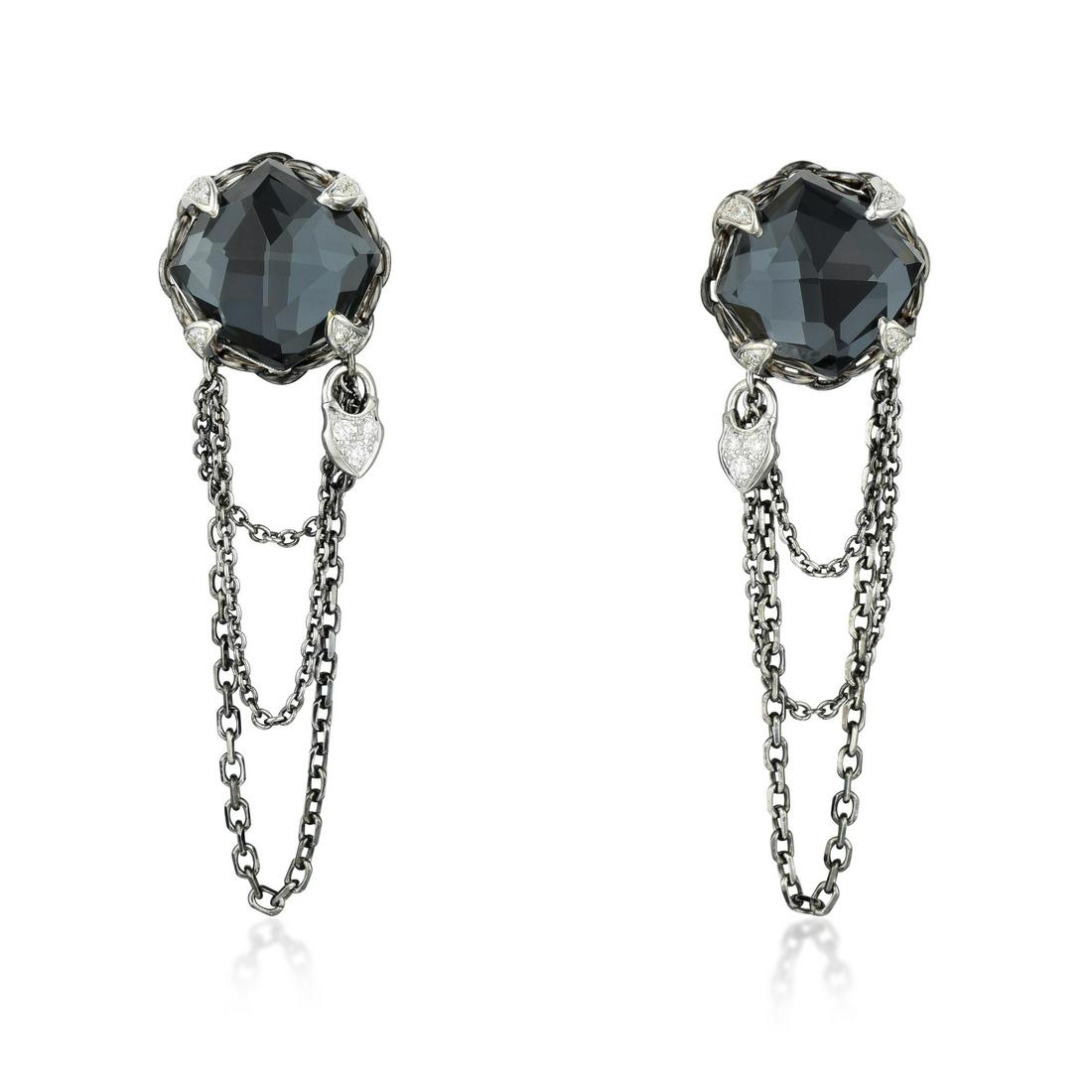 Stephen Webster Hematite Quartz and Diamond Earrings: METAL: 18K white gold GEMSTONE(S): round brilliant-cut diamonds approx. 0.20 carat total, most G-H/SI ; accented with hematite and clear quartz MEASUREMENTS: 1-3/4 x 1/2 inches WEIGHT: 11.20 g. Retail
