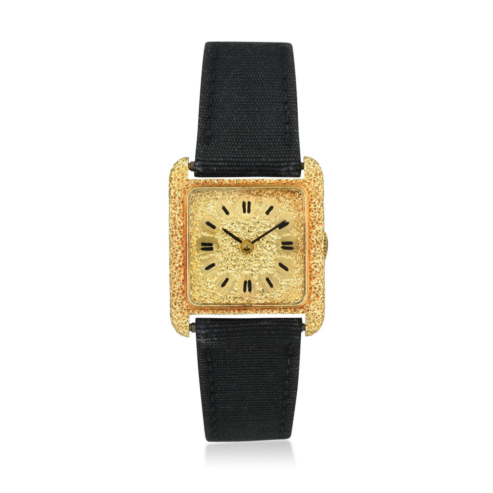 Gianmaria Buccellati Ladies Watch in 18K Gold: CIRCA: 1970s CASE MATERIAL: 18K gold CASE DIMENSIONS: 20 x 23 mm DIAL: Textured gold with baton hour markers BRACELET MATERIAL: Tissue strap with Buccellati-signed 18K gold textured buckle BRACELET SI