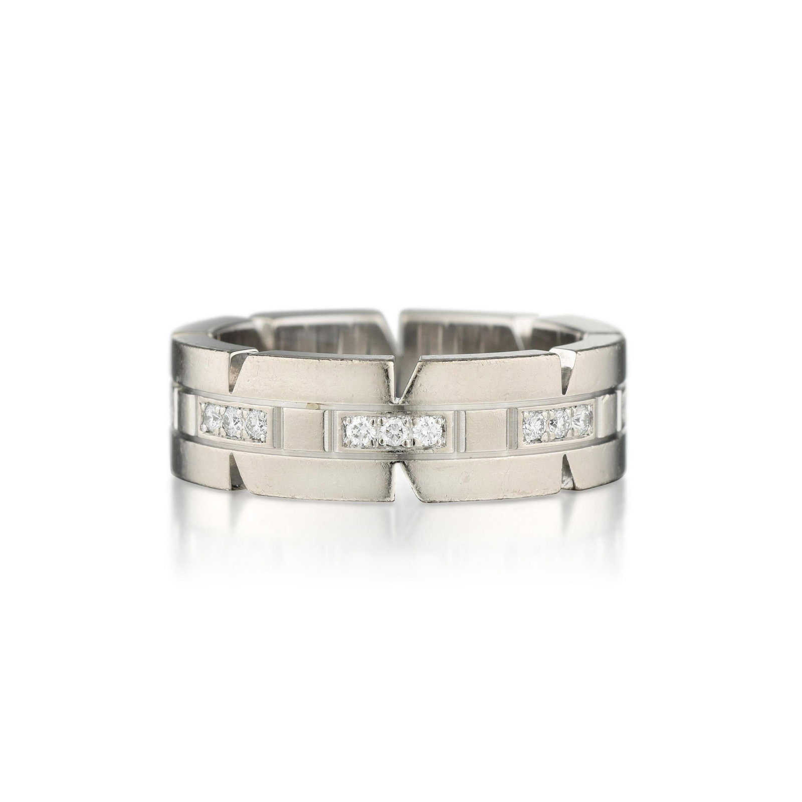 Cartier Tank Francaise Diamond Ring: METAL: 18K white gold GEMSTONE(S): round brilliant-cut diamonds approx. 0.25 carat total, most F-G/VS MEASUREMENTS: width 1/4 inch RING SIZE: 5-1/4, Cartier size 50 WEIGHT: 8.60 g. Signed: Cartier; Nu