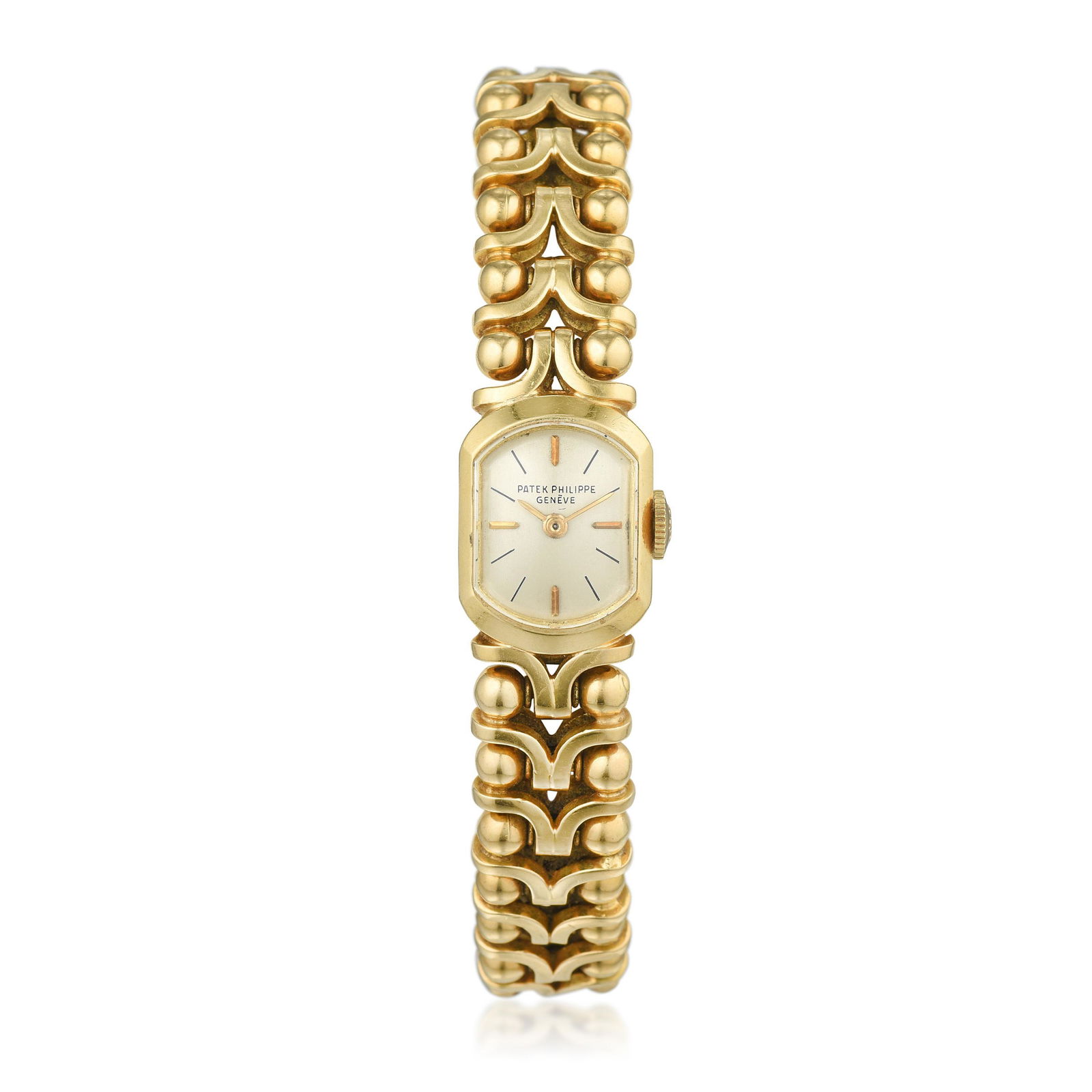 Patek Philippe Ref. 3100 Ladies Watch in 18K Gold: Crafted in 18K gold; off white dial with baton hour markers; inner circumference measures 7 inches, case 1/2 x 3/4 inch; powered by a manual wind Patek Philippe movement; weight 61.40 g. Signed: Patek