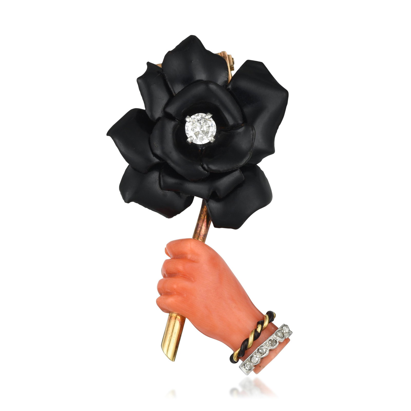 Cartier Art Deco Carved Coral Hand and Enamel Rose Pin: Crafted in 18K gold; set with a center round brilliant-cut diamond weighing approximately 0.30 carat, with F-G color and VS clarity; accented with rose-cut diamonds; black enamel on rose petals and br
