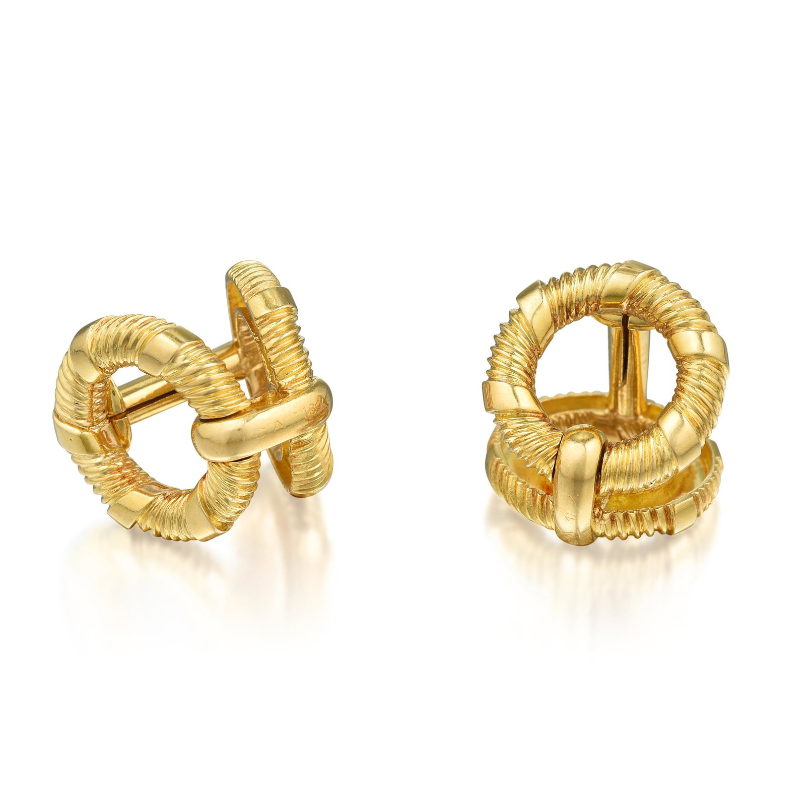 Van Cleef & Arpels Cufflinks: Crafted in 18K gold; fronts and backs measure 3/4 inch in diameter; weight 22.30 g. Signed: VCA; Numbered: C9023R1; Stamped: 18K, French hallmarks