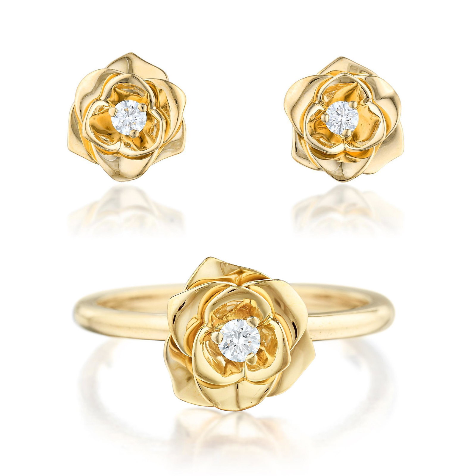 Piaget Diamond Rose Earrings and Ring Set: Crafted in 18K rose gold; set with round brilliant-cut diamonds weighing a total of approximately 0.20 carat, most with F-G color and VVS clarity; ring and earring tops measure 3/8 inch in diameter; r