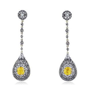 Mario Buccellati Yellow Sapphire and Diamond Drop: Crafted in 18K gold and silver; set with cushion-cut sapphires, weighing a total of approximately 2.70 carats; accented by rose-cut diamonds; measures 2-1/2 x 5/8 inches; weight 10.50 g. Signed: M.BUC