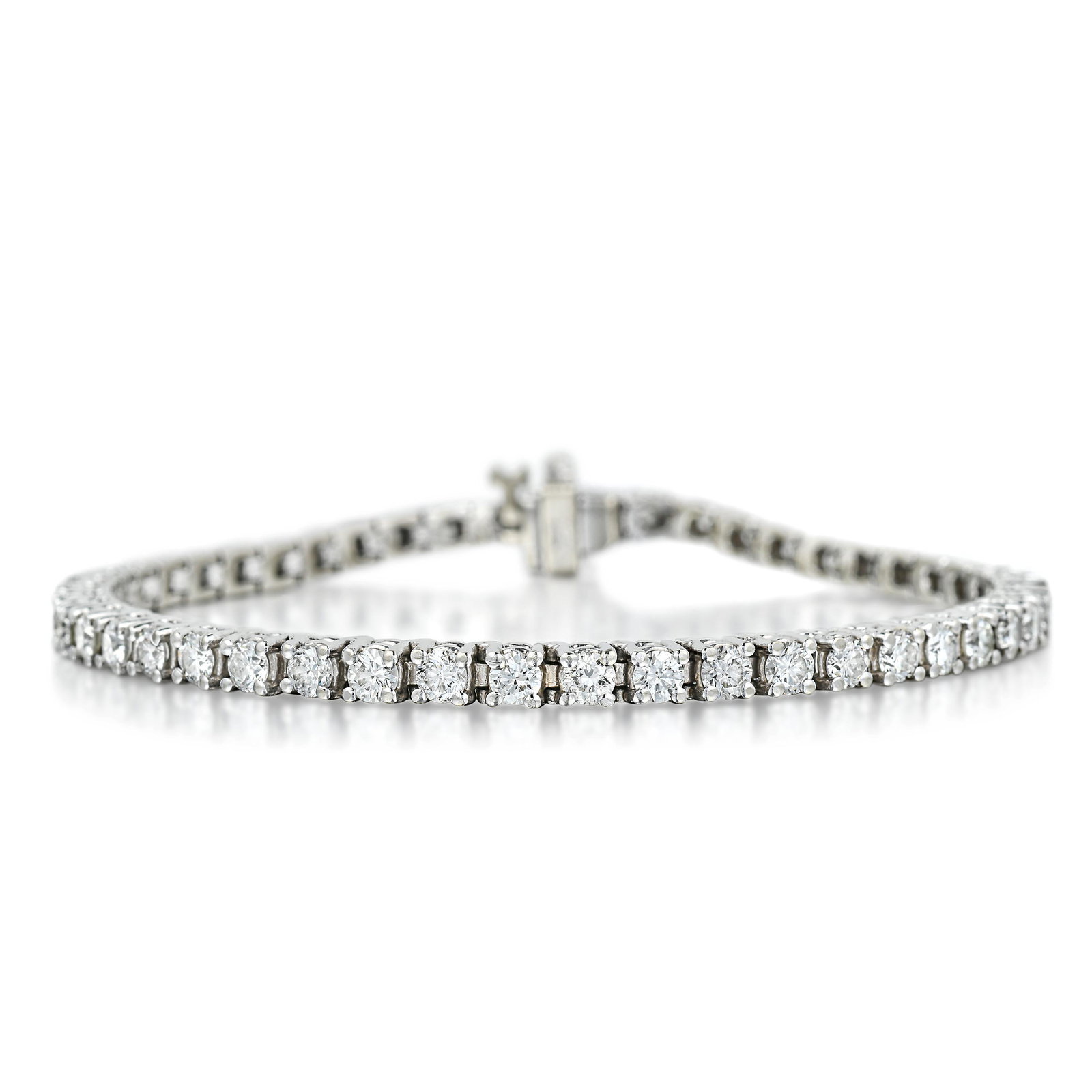 Diamond Tennis Bracelet: View a video of this lot here: https://youtu.be/PyxDgIwlv9A Crafted in 14K white gold; set with round brilliant-cut diamonds, weighing a total of approximately 4.90 carats, most with H-I color and SI 