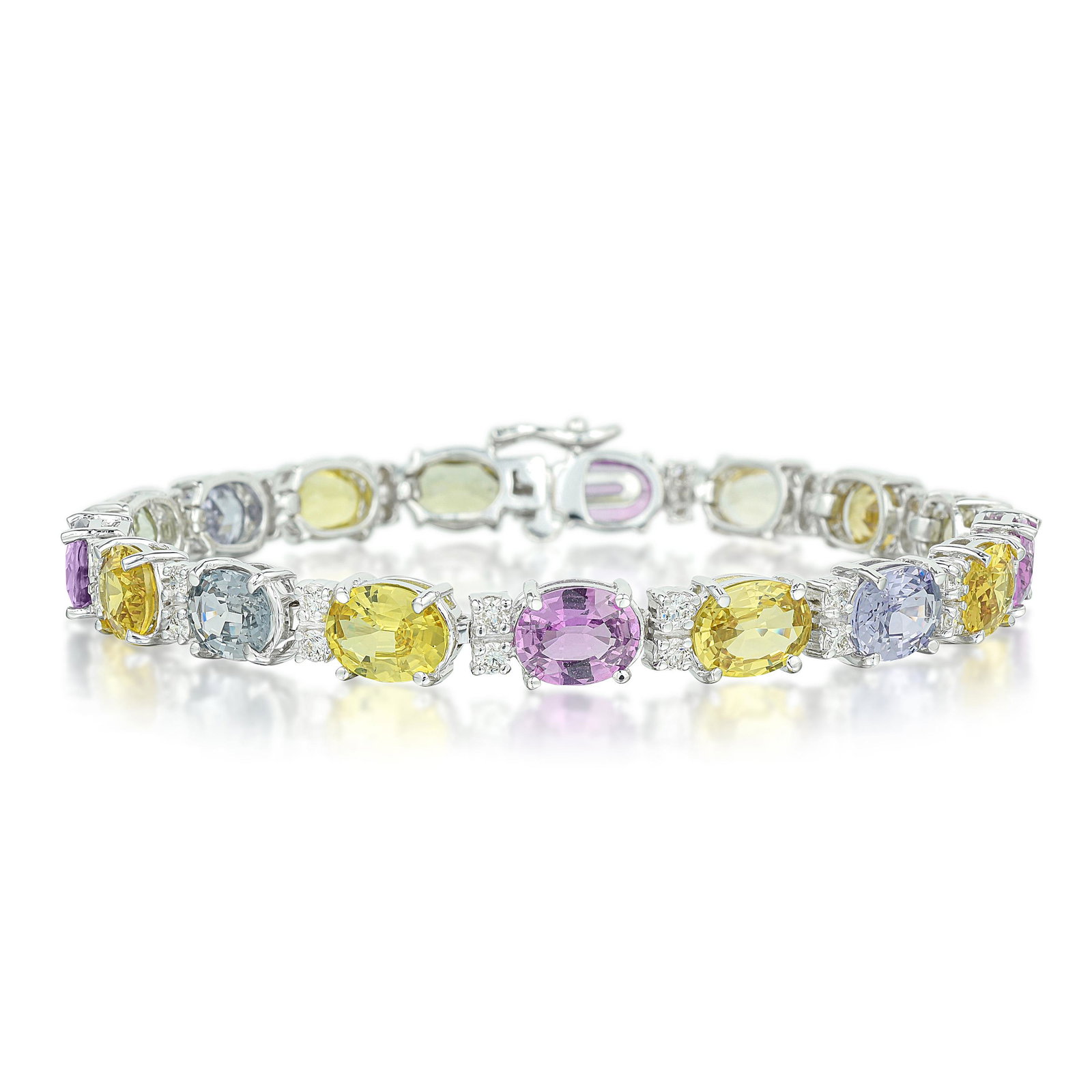 Unheated Multi-Colored Sapphire Bracelet: View a video of this lot here: https://youtu.be/PeBHH1vpgjM Crafted in 14K white gold; set with oval mixed-cut multi-colored unheated sapphires, weighing a total of approximately 25.50 carats; enhance
