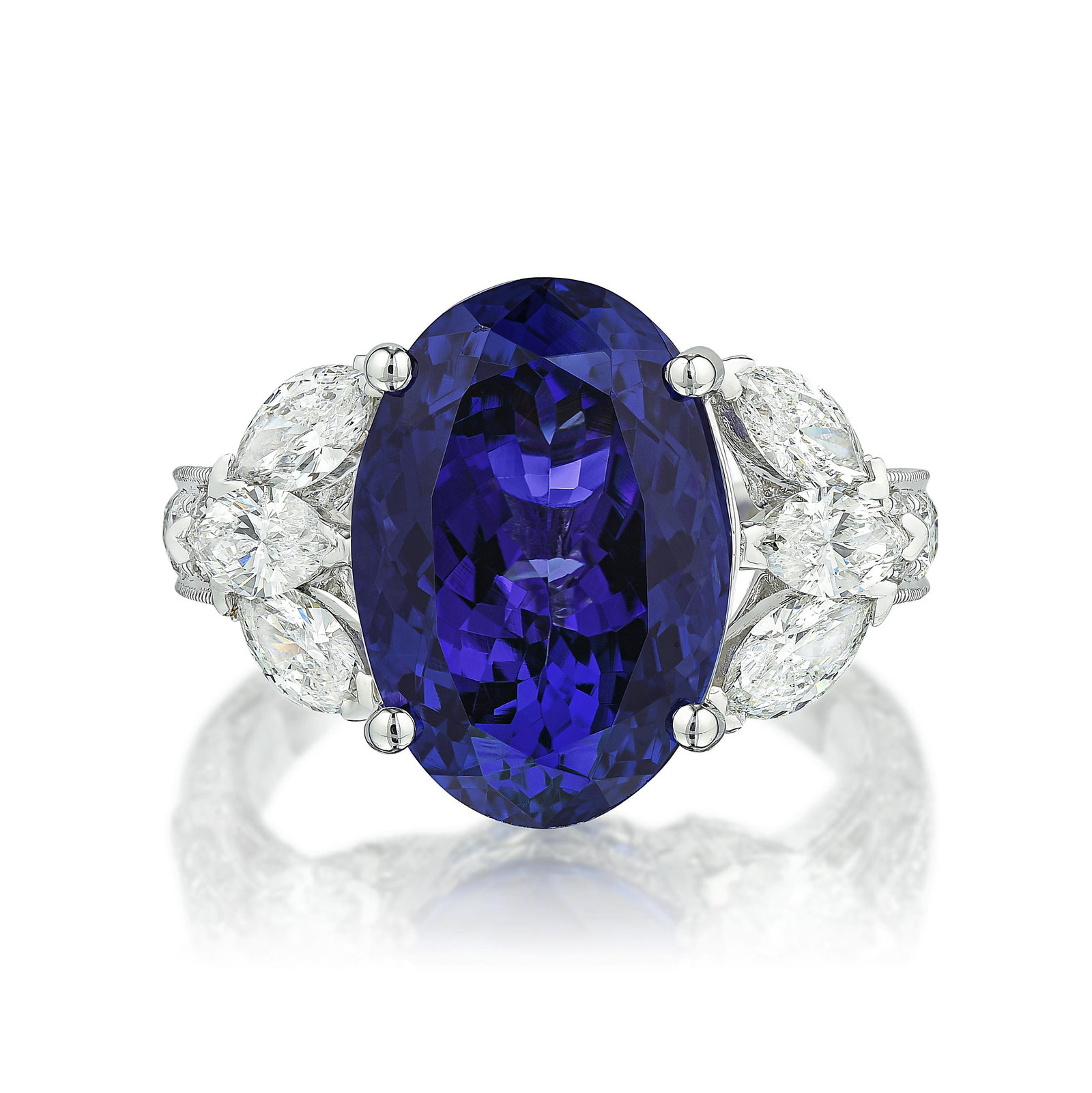 Tanzanite and Diamond Ring: View a video of this lot here: https://youtu.be/WVerqsavyPE Crafted in 18K white gold; set with an oval brilliant-cut tanzanite, weighing approximately 7.90 carats; accented by marquise- and round bri