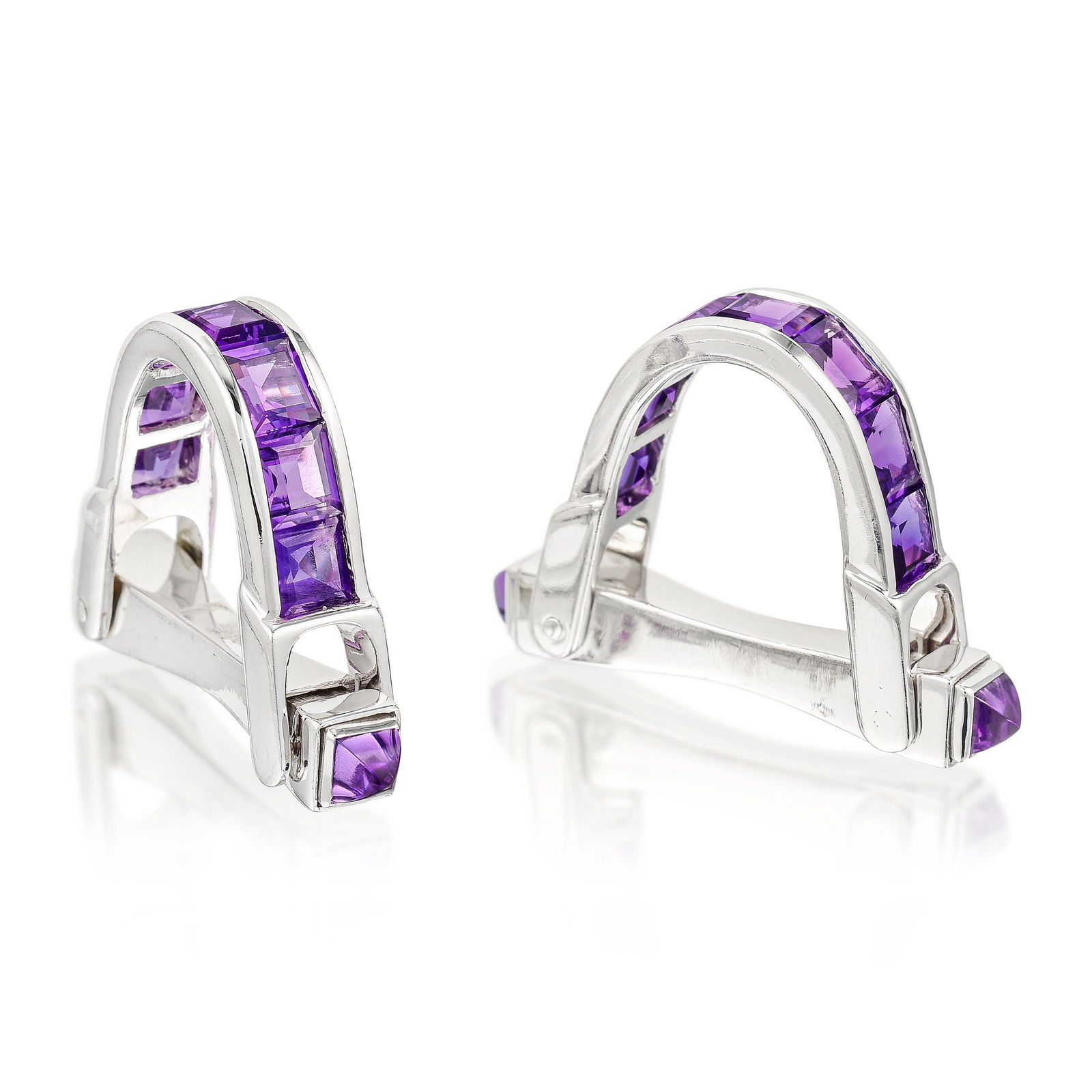 Amethyst Stirrup Cufflinks: View a video of this lot here: https://youtu.be/WK40X0AQ1XkCrafted in 18K white gold; set with sugar loaf and calibre-cut amethysts; measures 1/4 x 3/4 x 1-1/8 inches; weight 16.10 g.