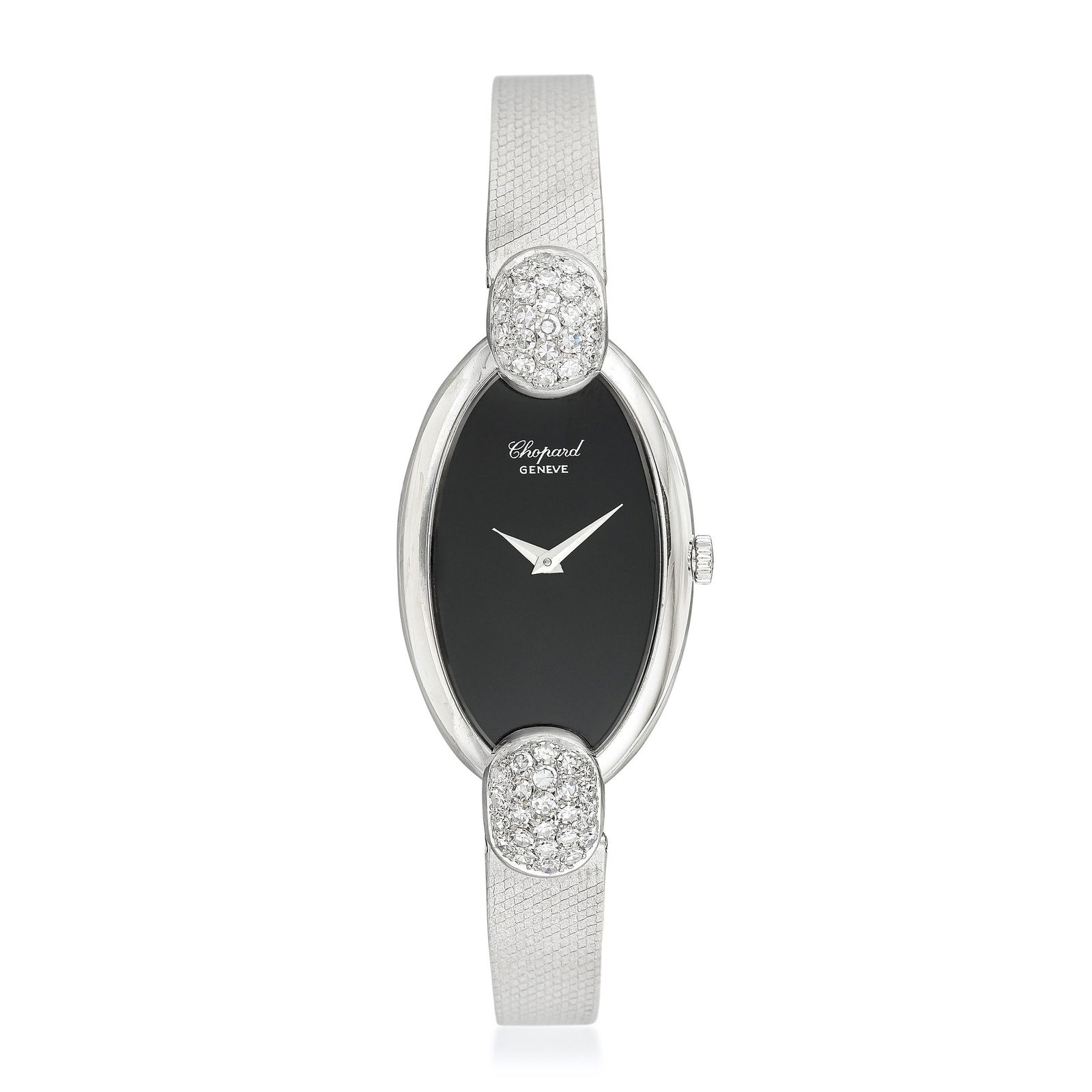 Chopard Ref. 5047/1 in 18K White Gold and Diamonds: CIRCA: 1970s SERIAL NUMBER: 71719 REF: 5047/1 CASE MATERIAL: 18K white gold CASE DIMENSIONS: 21 mm x 45 mm DIAL: Onyx with printed silver text GEMSTONE(S): single-cut diamonds (aftermarket) BRACELET M