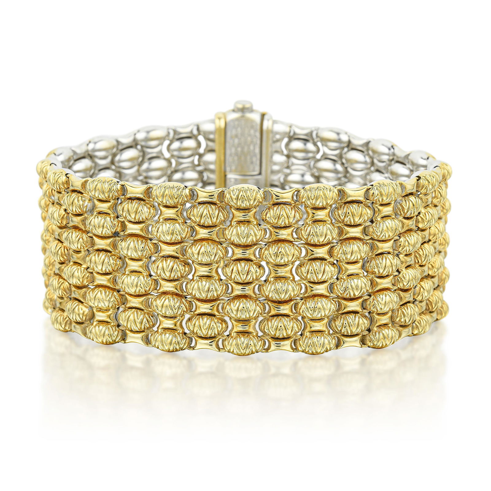 Chimento Reversible Two-Tone Wide Bracelet: View a video of this lot here: https://youtu.be/rqVqXxS9X-YCrafted in 18K white and yellow gold; accented with round brilliant-cut diamonds; measures 8 inches, 1-1/8 inches wide; weight 56.4 g.Signed: