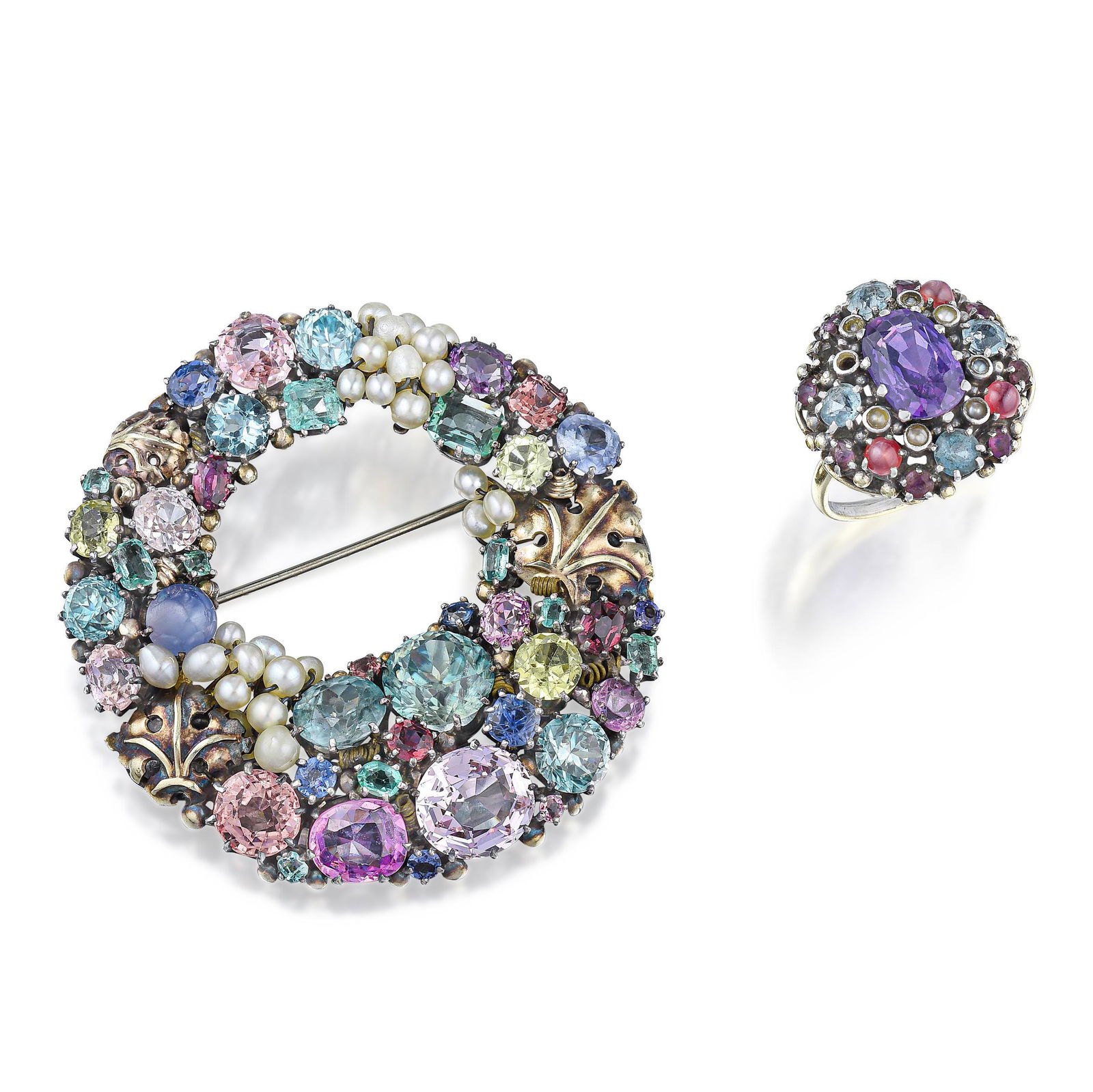 Dorrie Nossiter Arts and Crafts Multi-Gemstone Brooch: View a video of this lot here: https://youtu.be/OmMvW8mSzccCrafted in sterling silver and 18K gold; set with various shapes of multi-gemstones and seed pearls; brooch measures 2-1/8 x 2 inches; ring s