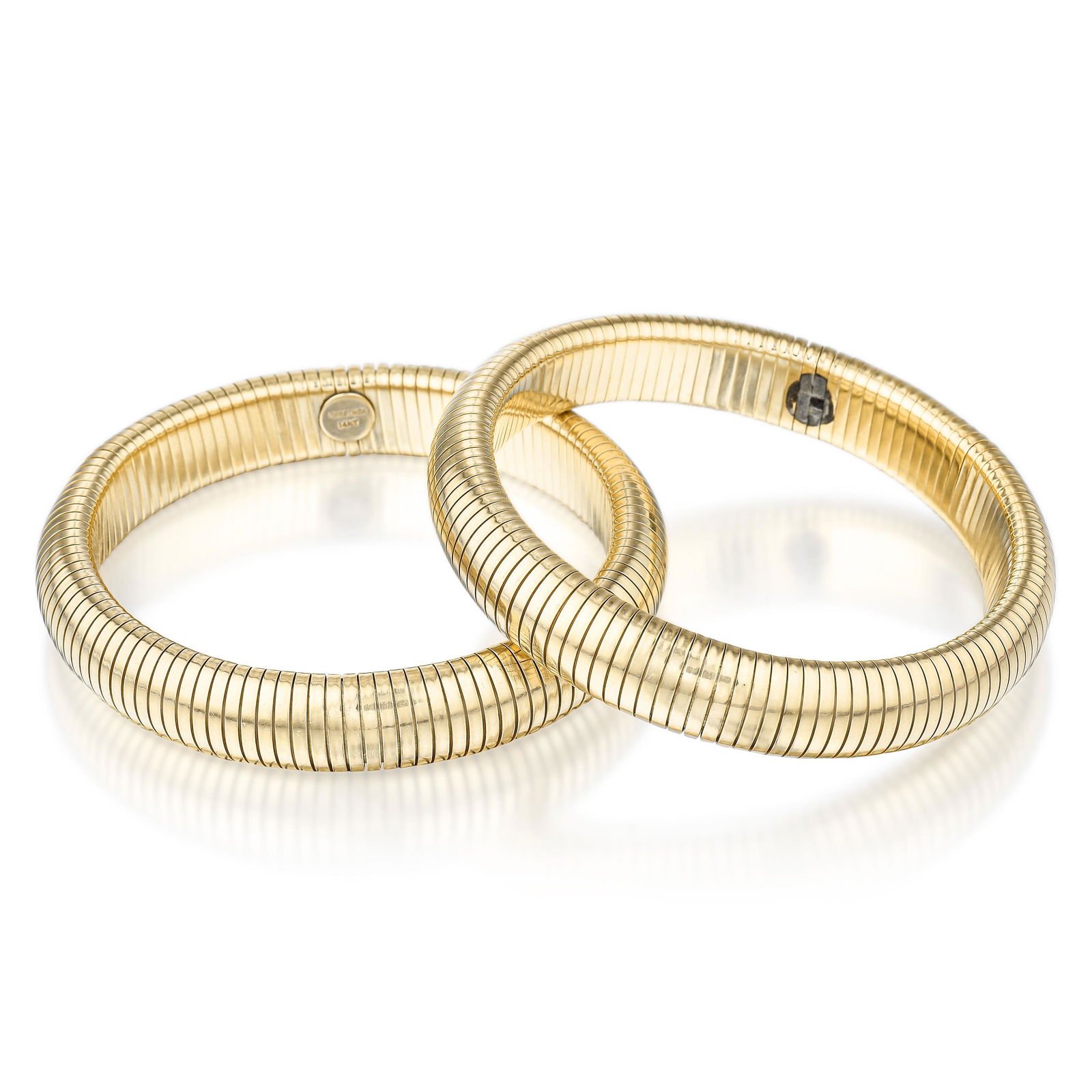 Set of Omega Link Bracelets: View a video of this lot: Click HereCrafted in 14K gold; inner circumference measures 6-5/8 inches, width 3/8 inch; weight 84.40 g.Stamped: 14KT, FORSTNERPROPERTY OF A