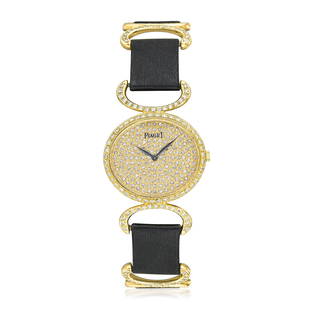 Piaget Ladies Watch in 18K Gold: CIRCA: 1980s SERIAL NUMBER: 324015 REF.: 9802DB CASE MATERIAL: 18K yellow gold GEMSTONE(S): single cut diamonds approx. 0.64 carat total CASE DIMENSIONS: 28 mm wide x 41 mm lug-to-lug DIAL: