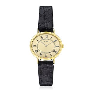 Piaget Ladies Watch in 18K Gold: CIRCA: 1970s SERIAL NUMBER: 328914 REF.: 9802 CASE MATERIAL: 18K yellow gold CASE DIMENSIONS: 27 mm wide x 23 mm lug-to-lug DIAL: silver sunburst dial with printed roman numeral hour markers 