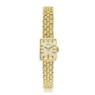 Rolex Ladies' Watch in 14K Gold: CIRCA: 1960s CASE MATERIAL: 14K yellow gold CASE DIMENSIONS: 14.5 mm x 19 mm DIAL: Gold basket weave dial BRACELET MATERIAL: 14K yellow gold integrated bracelet MAX. BRACELET SIZE: 6 1/2 inches 