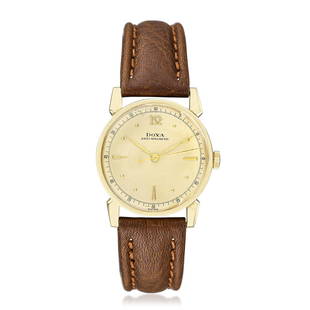 Doxa Men's Watch in 14K Gold: CIRCA: 1950s SERIAL NUMBER: 835302 CASE MATERIAL: 14K yellow gold CASE DIMENSIONS: 31 mm in diameter DIAL: Champagne dial with applied hour markers. Outer 60-seconds track. BRACELET MATERIAL: Brown le