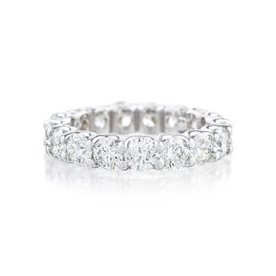 Diamond Eternity Band: METAL: 18K white gold GEMSTONE(S): round brilliant cut diamonds approx. 3.91 carats total, most G-H/SI MEASUREMENTS: width 1/8 inch RING SIZE: 6-1/4 WEIGHT: 4.70 g.