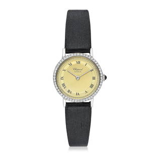 Chopard Ladies Watch in Steel: Summary of Key CharacteristicsCIRCA: 1970s CASE MATERIAL: Stainless steel with diamond bezel DIAL: Champagne guilloche dial with printed Roman numerals BRACELET MATERIAL: Original Chopard strap in