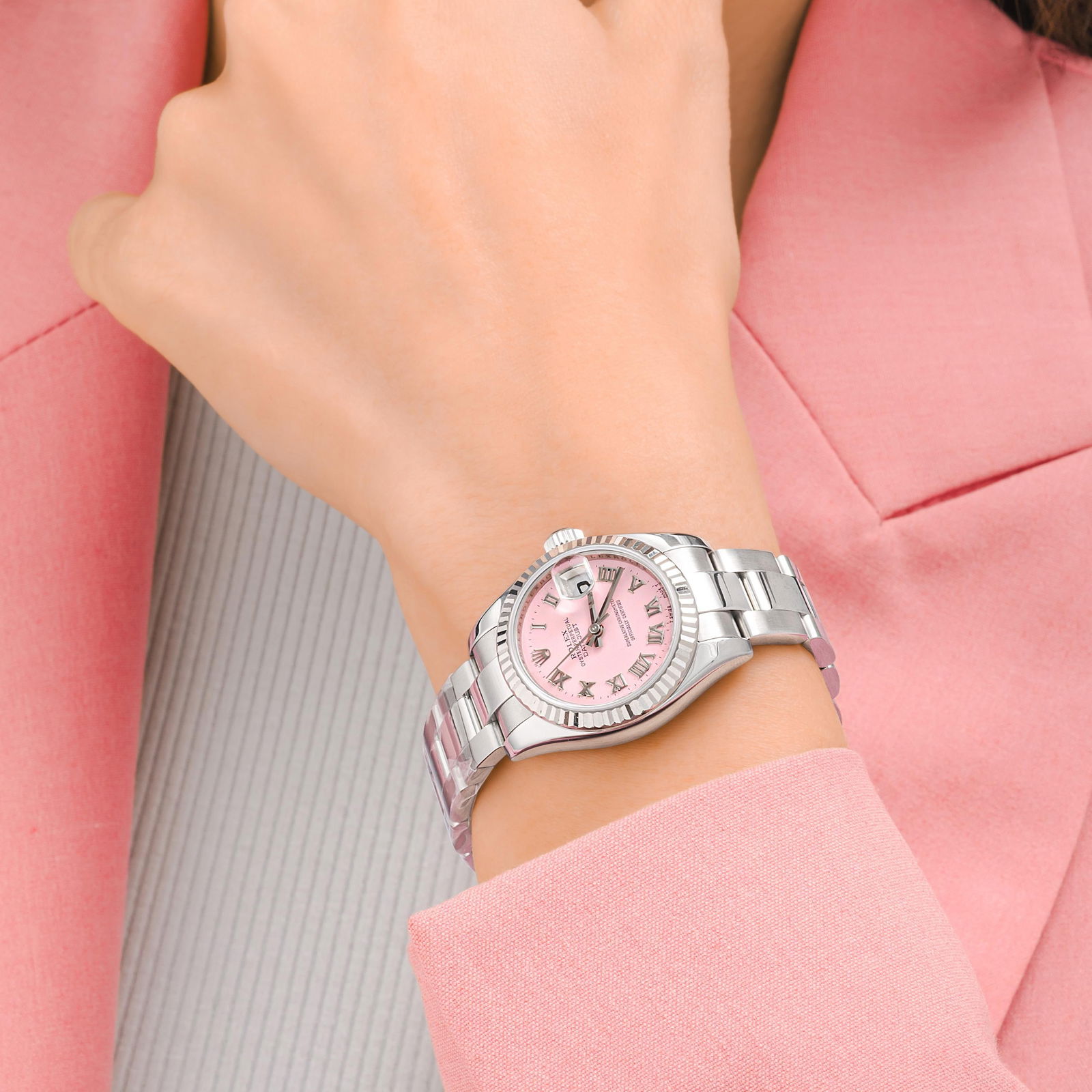 Rolex Datejust Ladies in Steel with Box and Papers: View a video of this lot: Click HereCIRCA: 2010s CASE MATERIAL: Stainless steel with 18k white gold bezel DIAL: Pink dial with applied Roman numerals BRACELET MATERI