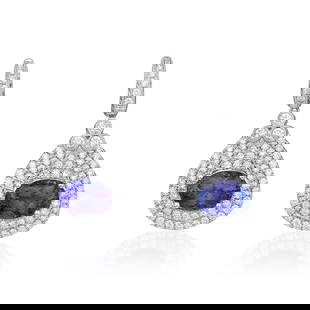 Tanzanite and Diamond Earrings: View a video of this lot: Click HereSummary of Key Characteristics • Metal: 18K white gold • Gemstone(s): oval brilliant cut tanzanite, weighing a tot