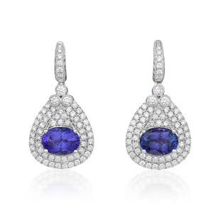 Tanzanite and Diamond Earrings: View a video of this lot: Click HereSummary of Key Characteristics • Metal: 18K white gold • Gemstone(s): oval brilliant cut tanzanite, weighing a total of approximately 9.87 carats;