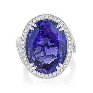 Tanzanite and Diamond Ring: View a video of this lot: Click HereSummary of Key Characteristics • Metal: 18K white gold • Gemstone(s): oval faceted tanzanite approx. 21.07 carats; round brilliant cut diamonds