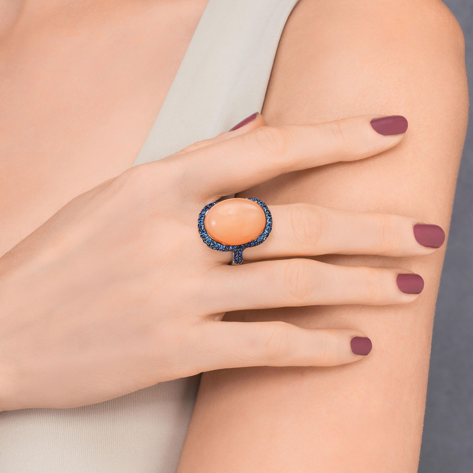 Crivelli Moonstone and Sapphire Cabochon Ring: View a video of this lot: Click HereSummary of Key Characteristics • Metal: 18k white gold • Gemstone(s): (1) oval cabochon moonstone weighing approx