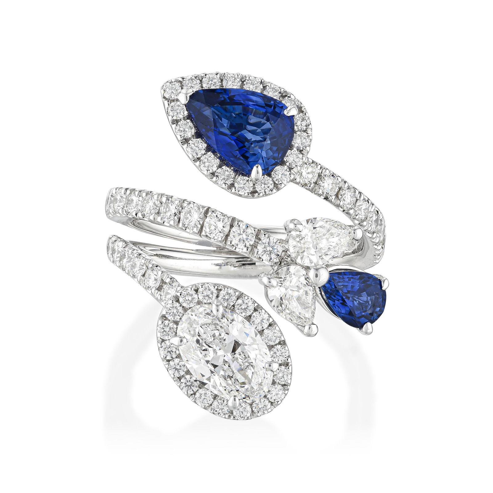 Crivelli Diamond and Sapphire Crossover Ring: View a video of this lot: Click HereSummary of Key Characteristics ‚Ä¢ Metal: 18k white gold ‚Ä¢ Gemstone(s): (1) oval brilliant diamonds weighing approximately 0.