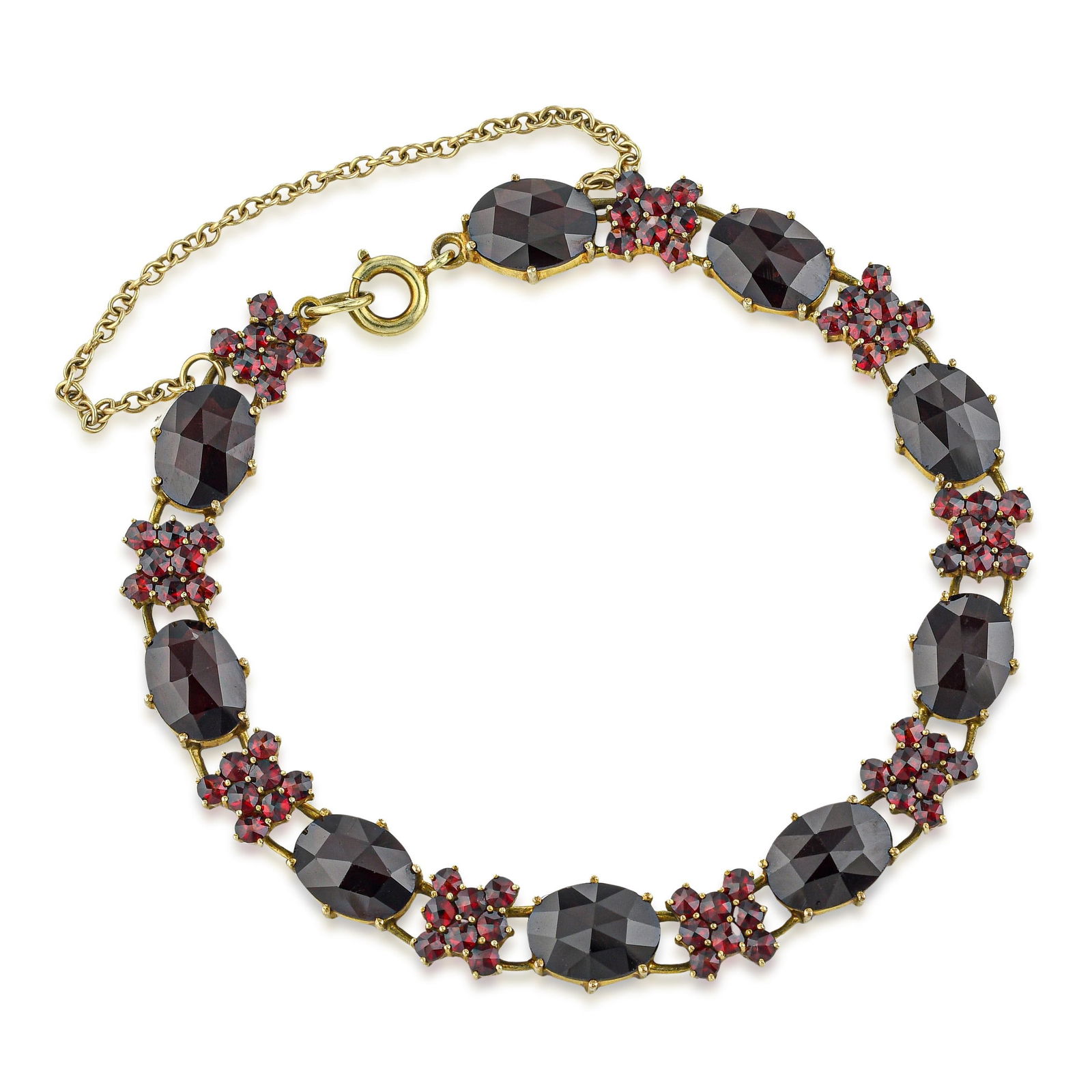 Vintage Garnet Bracelet: Summary of Key Characteristics • Metal: 14 K yellow gold • Measurements: 6 3/4 inches long • Weight: 11.1 g. • Condition: In very good condition.Global ShippingWith custome