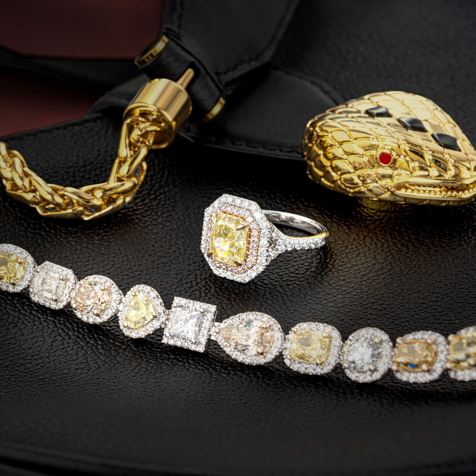 3.01-Carat Radiant Fancy Yellow Diamond Ring: Summary of Key Characteristics • Metal: 18K yellow / white gold • Gemstone(s): Radiant cut diamond approx. 3.01 carat fancy yellow/VS; round brilliant cut diamonds approx.0.75 carats