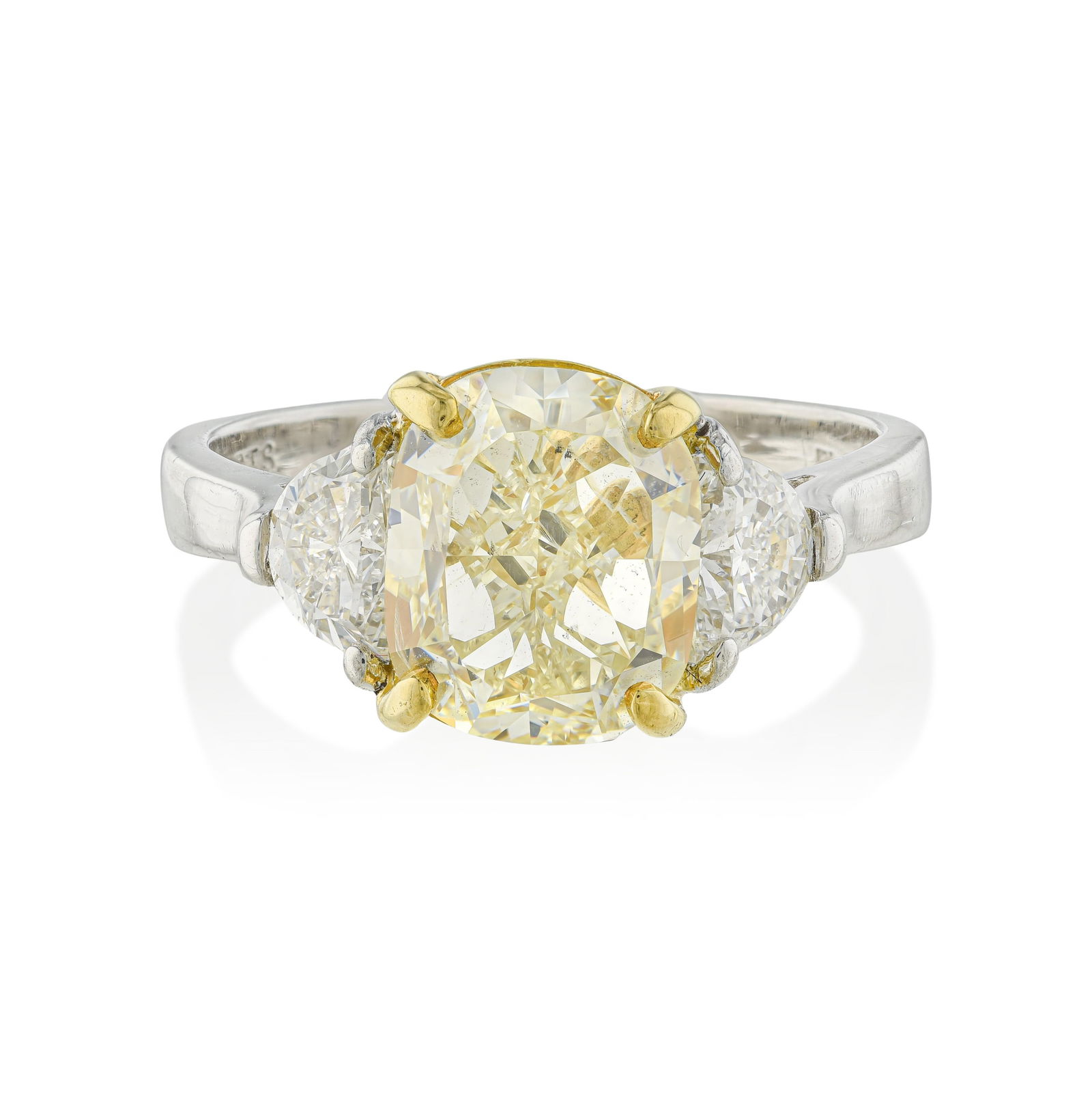 Fancy Yellow Diamond Ring: Summary of Key Characteristics • Metal: 18K yellow gold/ platinum • Gemstone(s): Cushion cut yellow diamond approx. 3.40 carats: half moon cut diamonds approx.0.75 carats total F-G/VS 